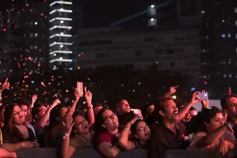 AFP via Getty Images Euphoric fans cheer for Bollywood singer Arijit Singh's live concert at MMRDA Grounds, BKC on Sunday November 12, 2017 in Mumbai, India. 